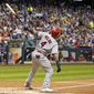 St. Louis Cardinals&#x27; Yadier Molina hits a two-run home run during the seventh inning of a baseball game against the Milwaukee Brewers Tuesday, Aug. 27, 2019, in Milwaukee. (AP Photo/Morry Gash)