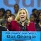 FILE - In a Friday, Nov. 2, 2018 file photo, Sarah Riggs Amico speaks during a rally for Democratic gubernatorial candidate Stacey Abrams, at Morehouse College in Atlanta. Business executive and 2018 candidate for lieutenant governor Sarah Riggs Amico announced her candidacy for the U.S. Senate Tuesday, August 27, 2019.  (Alyssa Pointer/Atlanta Journal-Constitution via AP, File)