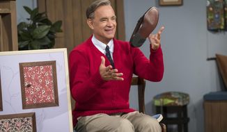 This image released by Sony Pictures shows Tom Hanks as Mister Rogers in a scene from &amp;quot;A Beautiful Day In the Neighborhood,&amp;quot; in theaters on Nov. 22. (Lacey Terrell/Sony-Tristar Pictures via AP)