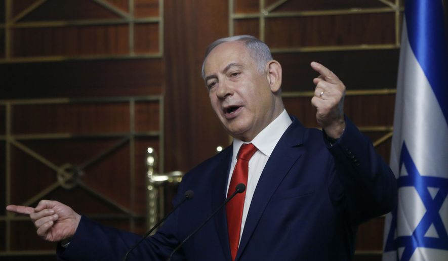 In this Tuesday, Aug. 20, 2019, file photo, Israeli Prime Minister Benjamin Netanyahu delivers a speech in Kyiv, Ukraine. The long shadow war between Israel and Iran has burst into the open in recent days, with Israel allegedly striking Iran-linked targets as far away as Iraq and crash-landing two drones in Lebanon. These incidents, along with an air raid in Syria that Israel says thwarted an imminent Iranian drone attack, have raised tensions at a particularly fraught time. (AP Photo/Efrem Lukatsky, File)