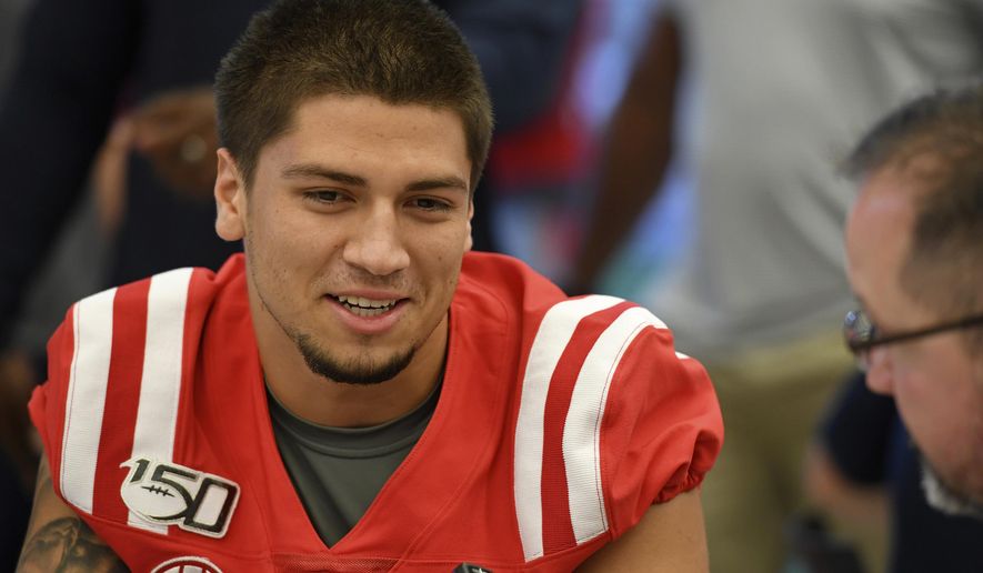 FILE - In this Thursday, Aug. 1, 2019, file photo, Mississippi quarterback Matt Corral speaks during a media day interview in Oxford, Miss. Mississippi has a new offensive coordinator in Rich Rodriguez and a new starting quarterback in Matt Corral as the Rebels adjust to life without second-round draft picks A.J. Brown and D.K. Metcalf catching passes. The new-look offense faces a tough early test as Ole Miss opens the season at Memphis. (AP Photo/Thomas Graning, File)
