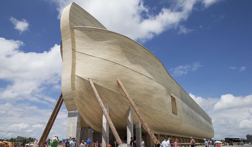 In this July 5, 2016, file photo, visitors pass outside the front of a replica Noah's Ark at the Ark Encounter theme park during a media preview day, in Williamstown, Ky. Grant County’s school board in Kentucky says the Christian theme park with a 500-foot-long Noah’s Ark is not paying enough in property taxes. (AP Photo/John Minchillo, File)