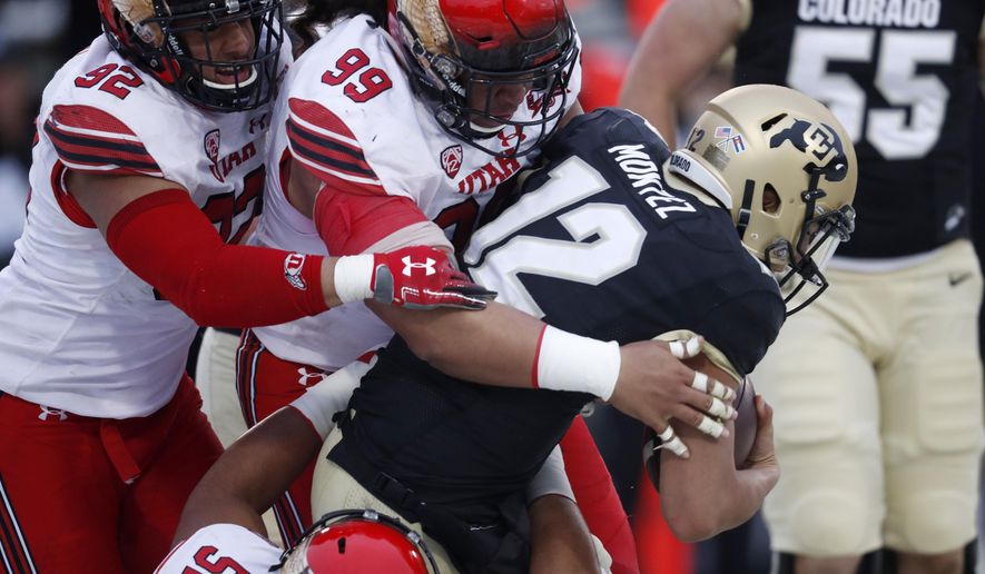 FILE - In this Nov. 17, 2018, file photo, Colorado quarterback Steven Montez (12) is sacked by Utah defenders John Penisini (99), Maxs Tupai (92) and Leki Fotu (52) during the second half of an NCAA college football game in Boulder, Colo. The 14th-ranked Utes return their entire two-deep front from last season, including Fotu and defensive end Bradlee Anae, who both graded well enough to project as early round picks in the 2019 NFL draft. (AP Photo/David Zalubowski, File)