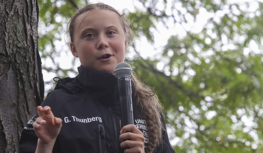 Greta Thunberg, a 16-year-old Swedish climate activist, speaks in front of a crowd of people after sailing in New York harbor aboard the Malizia II, Wednesday, Aug. 28, 2019. The zero-emissions yacht left Plymouth, England, on Aug. 14. She is scheduled to address the United Nations Climate Action Summit on Sept. 23. (AP Photo/Mary Altaffer)