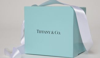 FILE - In this May 22, 2017, file photo, a gift box from Tiffany &amp;amp; Co. is arranged for a photo in Surfside, Fla. Tiffany &amp;amp; Co. reports financial results Wednesday, Aug. 28. (AP Photo/Wilfredo Lee, File)