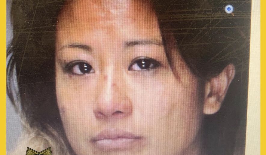 This undated photo that appears in an internet 'wanted' poster on the Sacramento County Sheriff's Facebook page shows 34-year-old Reychel Dizon as they seek the public's help in finding her. Officials say two Sacramento County children allegedly abducted from school by their mother have been found safe and unharmed. The Sacramento County Sheriff's Office said Wednesday, Aug. 28, 2019 that a Sacramento police officer found the children, a girl, 6, and a boy, 10, Tuesday night while responding to a call in downtown Sacramento. (Sacramento County Sheriff's Office via AP)