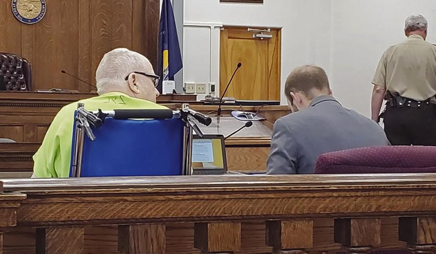 File - In this Aug. 13, 2019, file photo, James Jensen, 79, waits alongside his attorney Garret Wilson during a court hearing in Miles City, Montana. Jensen was sentenced Wednesday, Aug. 28, 2019, to 20 years in prison for having child pornography on his computer. The sentence will run consecutive to a 12-year federal sentence for using the internet to coerce and entice male athletes at Custer County District High School into being sexually abused under the guise of improving their athletic performance. The statute of limitations to prosecute the actual abuse has expired, but 32 men have filed a civil lawsuit against Jensen and the school district. (Ashley Wise/Miles City Star via AP, File)
