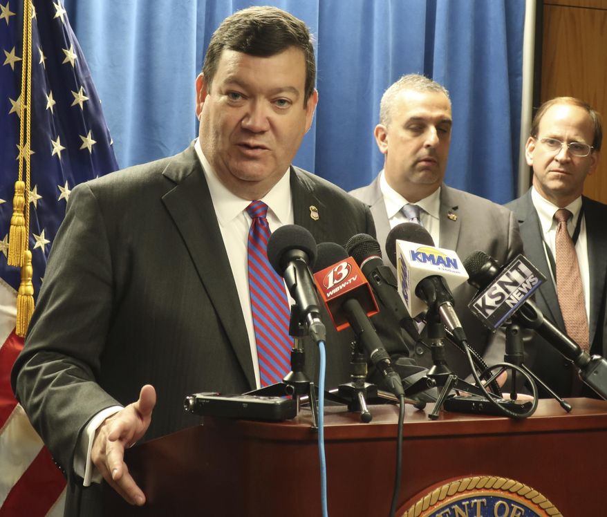 Stephen McAllister, the U.S. attorney for Kansas, answers questions from reporters during a news conference, Wednesday, Aug. 28, 2019, in Topeka, Kan., about what authorities are calling a major drug-trafficking operation in northeast Kansas. More than 50 people have been charged with crimes and authorities blame the operation for a Kansas State University student's overdose death in 2017. (AP Photo/John Hanna)