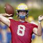 FILE - This Aug. 2, 2019, file photo shows Pittsburgh quarterback Kenny Pickett as he passes in a drill during an NCAA college football practice in Pittsburgh. How far Pitt goes toward repeating as ACC Coastal Division champions will rely heavily on if quarterback Kenny Pickett and new offensive coordinator Mark Whipple can revive a dormant passing game. (AP Photo/Keith Srakocic, File)