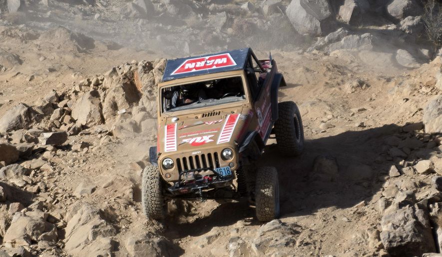 In this Feb. 8, 2018, file photo, Jessi Combs of Long Beach, Calif., drops into the final chute before the finish line of the Smitty Built Everyman's Challenge Race of the King of the Hammers in Lucerne Valley, Calif., Thursday, Feb. 8, 2018. The Harney County Sheriff's Office confirmed Wednesday, Aug. 28, 2019, that Combs died in the single-car crash in a dry lake bed in the remote desert around 4 p.m. Tuesday. The 36-year-old Combs was known as the "fastest woman on four wheels" for setting a land-speed record of 298 mph (480 kph). (James Quigg/The Daily Press via AP, File)