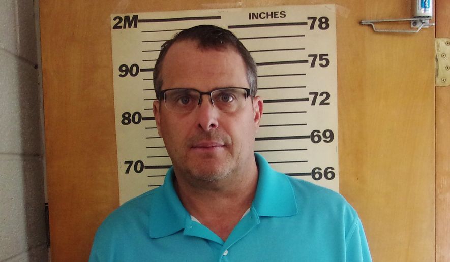 This undated booking photo provided by the Glen Dale Police Department shows West Virginia state Sen. Mike Maroney. He has been charged with soliciting a prostitute. The Republican lawmaker turned himself in and was arraigned Wednesday morning, Aug. 28, 2019, a Marshall County court clerk said. He has pleaded not guilty and paid a $4,500 bond. (Glen Dale Police Department via AP)