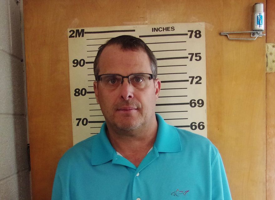 This undated booking photo provided by the Glen Dale Police Department shows West Virginia state Sen. Mike Maroney. He has been charged with soliciting a prostitute. The Republican lawmaker turned himself in and was arraigned Wednesday morning, Aug. 28, 2019, a Marshall County court clerk said. He has pleaded not guilty and paid a $4,500 bond. (Glen Dale Police Department via AP)