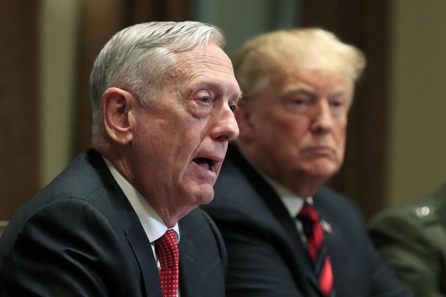 In this Oct. 23, 2018, file photo, then-Defense Secretary Jim Mattis speaks beside President Donald Trump, during a briefing with senior military leaders in the Cabinet Room at the White House in Washington. Mattis warns bitter political divisions have pushed American society to the “breaking point” in his most extensive public remarks since he resigned in protest from the Trump administration.  (AP Photo/Manuel Balce Ceneta) ** FILE **