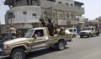 In this frame grab from video provided by Yemen Today, Yemeni army vehicles enter Zinjibar, Yemen, Wednesday, Aug. 28, 2019. Yemeni officials and local residents say forces loyal to the country&#39;s internationally recognized government have wrested control of the capital of southern Abyan province from separatists backed by the United Arab Emirates. They say government forces on Wednesday pushed the UAE-backed militia, known as the Security Belt, out of Zinjibar after clasher that left at least one dead and 30 wounded fighters. (Yemen Today via AP)