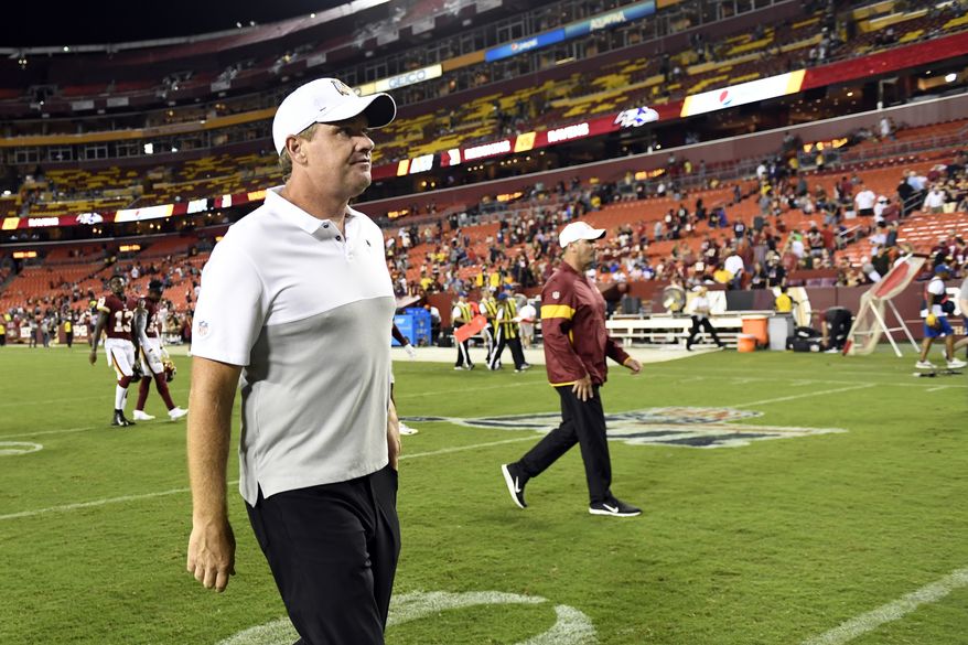 Washington Redskins head coach Jay Gruden walks off of the field following an NFL preseason football game against the Baltimore Ravens at FedEx Field in Landover, Md., Thursday, Aug. 29, 2019. The Ravens beat the Redskins, 20-7. (AP Photo/Susan Walsh)