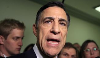 FILE - In this Dec. 7, 2018 file photo Rep. Darrell Issa, R-Calif., speaks to reporters as he leaves a House Judiciary and Oversight Committee closed-door interview on Capitol Hill in Washington. Issa has taken a step toward challenging indicted U.S. Rep. Duncan Hunter for a Southern California seat. Issa says on his website that he formed an exploratory committee to replace fellow Republican Hunter, who is scheduled to be tried in January for allegedly siphoning campaign money for personal use. The committee allows Issa to raise money. (AP Photo/Manuel Balce Ceneta,File)