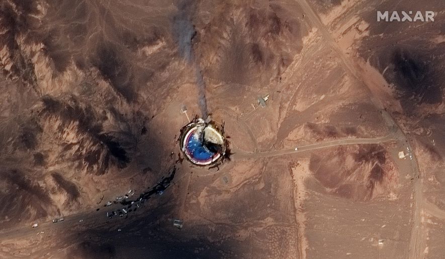This satellite image from Maxar Technologies shows a fire at a rocket launch pad at the Imam Khomeini Space Center in Iran&#39;s Semnan province, Thursday, Aug. 29, 2019. Satellite images released Thursday show the smoldering remains of a rocket at a Iran space center that was to conduct a U.S.-criticized satellite launch. (Satellite image ©2019 Maxar Technologies via AP)