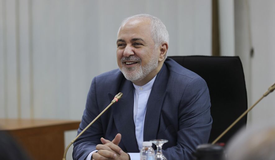 Iranian Foreign Minister Mohammad Javad Zarif smiles as he speaks during a forum titled &amp;quot;Common Security in the Islamic World&amp;quot; in Kuala Lumpur, Malaysia, Thursday, Aug. 29, 2019. Zarif said Iran’s supreme leader will not meet with U.S. President Donald Trump unless Washington halts its “economic terrorism” that has hurt ordinary Iranian civilians. Zarif said the removal of U.S. sanctions could also help salvage the Iranian nuclear deal, which may break apart after the U.S. left last year. (AP Photo/Vincent Thian)