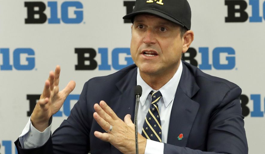 FILE - In this July 19, 2019, file photo, Michigan head coach Jim Harbaugh responds to a question during the Big Ten Conference NCAA college football media days in Chicago. The strength of Michigan's schedule is its balance. (AP Photo/Charles Rex Arbogast, File)