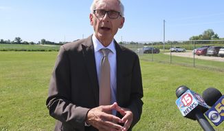 Gov. Tony Evers says he doesn&#39;t fault Republicans for not wanting to sign confidentiality agreements as requested by fellow Democratic Attorney General Josh Kaul on Thursday, Aug. 29, 2019, in Beaver Dam, Wisconsin. Evers told reporters that Republicans who stand in the way of Kaul settling lawsuits on behalf of the state need to figure out a resolution so Wisconsin does not lose millions of dollars in settlement money. (AP Photo/Scott Bauer)