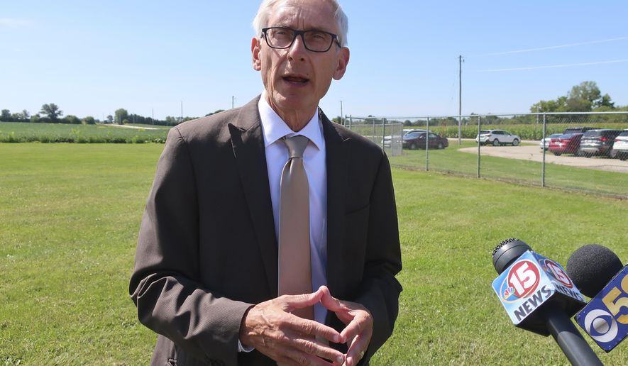 Gov. Tony Evers says he doesn&#x27;t fault Republicans for not wanting to sign confidentiality agreements as requested by fellow Democratic Attorney General Josh Kaul on Thursday, Aug. 29, 2019, in Beaver Dam, Wisconsin. Evers told reporters that Republicans who stand in the way of Kaul settling lawsuits on behalf of the state need to figure out a resolution so Wisconsin does not lose millions of dollars in settlement money. (AP Photo/Scott Bauer)