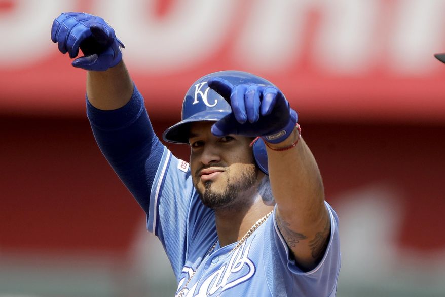 Kansas City Royals&#39; Cheslor Cuthbert celebrates on second after hitting a two-run double during the fifth inning of a baseball game against the Oakland Athletics Thursday, Aug. 29, 2019, in Kansas City, Mo. (AP Photo/Charlie Riedel)