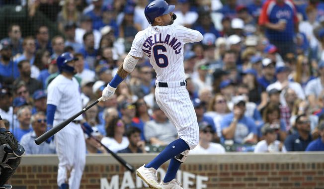Chicago Cubs&#x27; Nicholas Castellanos watches his two-run home run during the second inning of a baseball game against the Milwaukee Brewers Friday, Aug 30, 2019, in Chicago. (AP Photo/Paul Beaty)