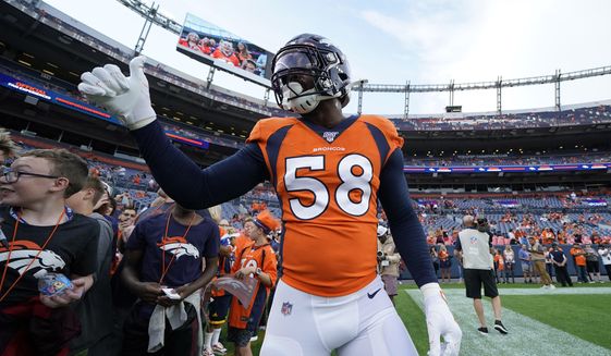 Denver Broncos outside linebacker Von Miller (58) gives a thumbs up tp fans prior to an NFL preseason football game against the Arizona Cardinals, Thursday, Aug. 29, 2019, in Denver. (AP Photo/Jack Dempsey)