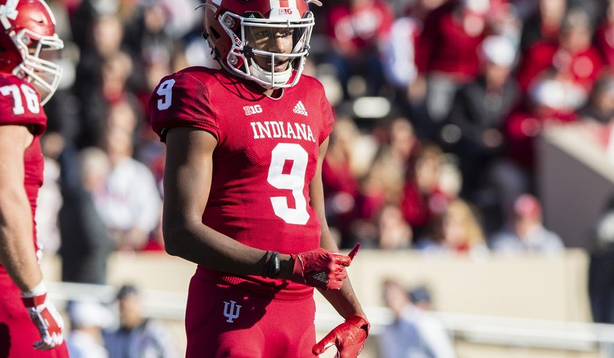 FILE - In this Saturday, Oct. 20, 2018, file photo, Indiana quarterback Michael Penix Jr. (9) looks to the sideline during the first half of an NCAA college football game in Bloomington, Ind. The wait is almost over for Indiana quarterback Michael Penix Jr. A highly-touted high school recruit who lost last summer’s battle to become Indiana’s starting quarterback, who redshirted after tearing the anterior cruciate ligament in his right knee last October, who only did limited work during the spring as he recovered will make his first college start Saturday against Ball State. (AP Photo/Doug McSchooler, File)