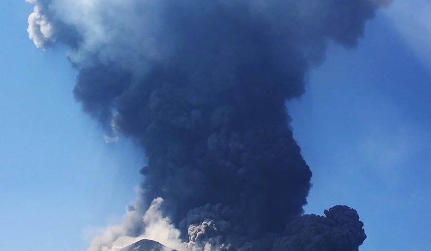 In this frame grab taken from a video provided by Marta Carpinelli to the Associated Press Television, smoke billows from the volcano on the Italian island of Stromboli, Wednesday, Aug. 28, 2019. The Stromboli volcano has erupted, spewing fiery chunks of lava onto the tiny Italian island and alarming residents and tourists. The National Institute of Geophysics and Volcanology says a strong volcanic explosion just after noon Wednesday sent flaming lava rolling down the volcano's slopes to the edge of the sea. A similarly spectacular eruption in July on Stromboli killed an Italian hiker. (Marta Carpinelli Via AP)