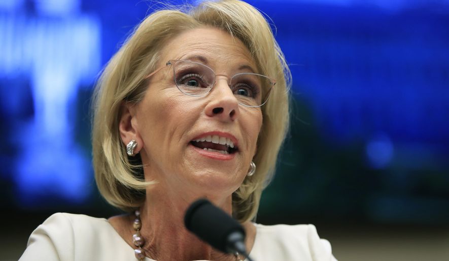 In this April 10, 2019, file photo, Education Secretary Betsy DeVos testifies before the House Education and Labor Committee at a hearing on &quot;Examining the Policies and Priorities of the U.S. Department of Education&quot; on Capitol Hill in Washington. (AP Photo/Manuel Balce Ceneta, File)