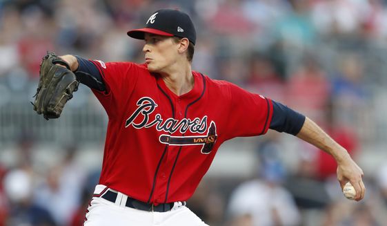 Atlanta Braves starting pitcher Max Fried works in the first inning of a baseball game against the Chicago White Sox, Friday, Aug. 30, 2019, in Atlanta. (AP Photo/John Bazemore)