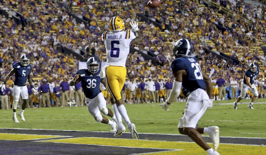LSU wide receiver Terrace Marshall Jr. (6) catches a 3-yard touchdown against Georgia Southern in the second quarter of an NCAA college football game in Baton Rouge, La., Saturday, Aug. 31, 2019. (AP Photo/Michael Democker)