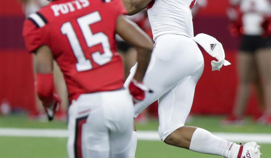Indiana wide receiver Nick Westbrook, right, makes a catch in front of Ball State cornerback Tyler Potts (15) on his way to a touchdown during the first half of a college football game in Indianapolis, Saturday, Aug. 31, 2019. (AP Photo/Michael Conroy)