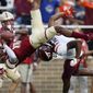 Boston College defensive back Brandon Sebastian (10) intercepts the pass intended for Virginia Tech wide receiver Phil Patterson during the second half of an NCAA college football game in Boston, Saturday, Aug. 31, 2019. (AP Photo/Michael Dwyer)