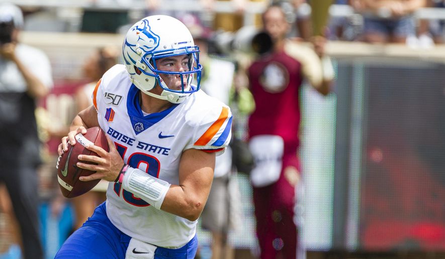Boise State quarterback Hank Bachmeier (19) rolls out to pass in the first half of an NCAA college football game against Florida State in Tallahassee, Fla., Saturday, Aug. 31, 2019. (AP Photo/Mark Wallheiser)