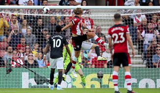 Southampton&#39;s Jannik Vestergaard, center, scores his side&#39;s first goal of the game during the English Premier League soccer match at St Mary&#39;s, Southampton, England, Saturday Aug. 31, 2019. (Mark Kerton/PA via AP)