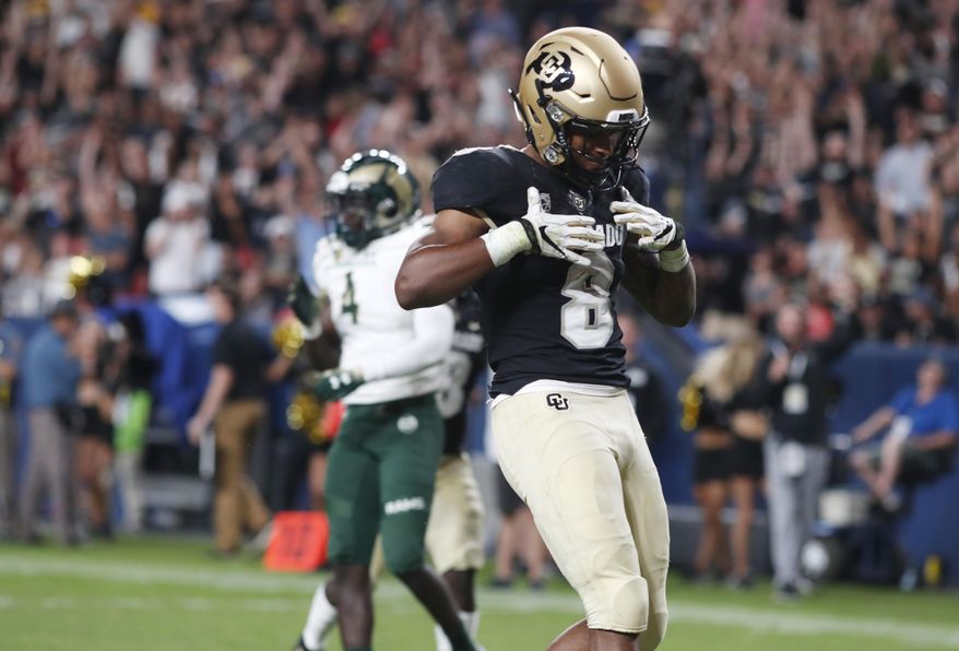 Colorado running back Alex Fontenot celebrates after his run for a touchdown against Colorado State during the third quarter of an NCAA college football game Friday, Aug. 30, 2019, in Denver. (AP Photo/David Zalubowski)