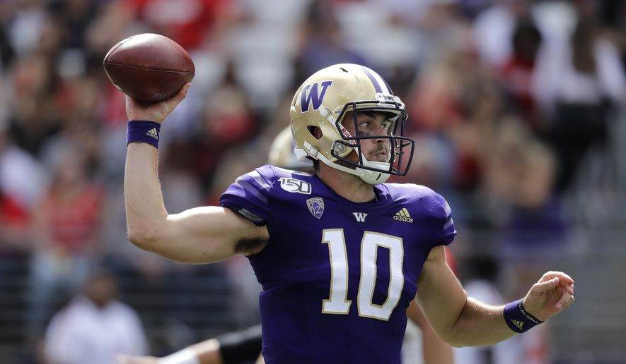 Washington quarterback Jacob Eason passes against Eastern Washington in the first half of an NCAA college football game Saturday, Aug. 31, 2019, in Seattle. (AP Photo/Elaine Thompson)
