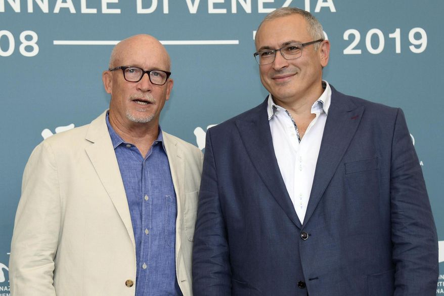Russian opposition figure Mikhail Khodorkovsky, the former owner of the Yukos Oil Company, right, and Director Alex Gibney pose for photographers during the photocall of the movie 'Citizen K ' at the 76th annual Venice International Film Festival, in Venice, Italy, Saturday, Aug. 31, 2019. (Claudio Onorati/ANSA via AP)