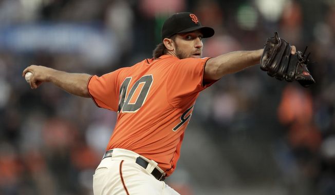 San Francisco Giants pitcher Madison Bumgarner works against the San Diego Padres during the first inning of a baseball game Friday, Aug. 30, 2019, in San Francisco. (AP Photo/Ben Margot)