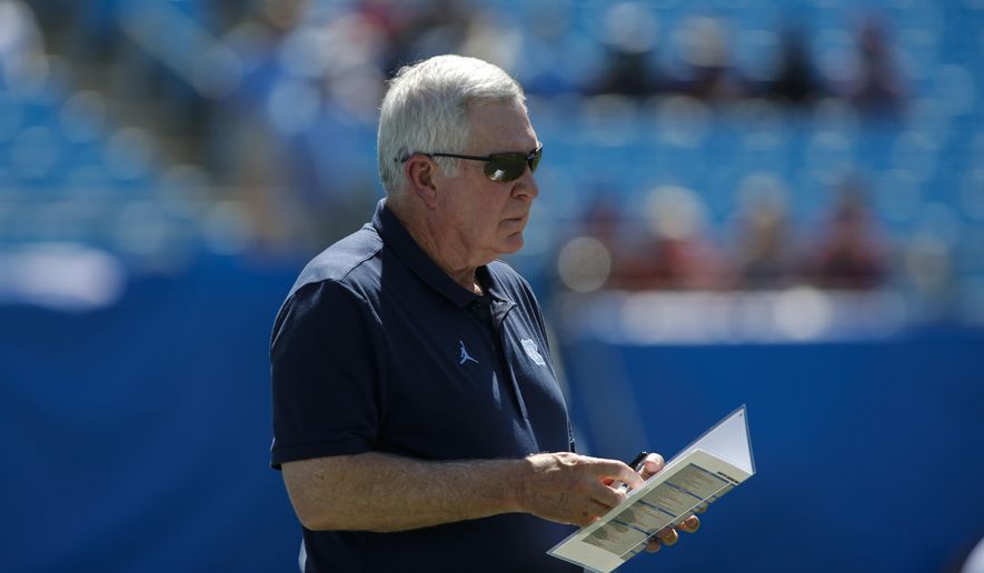 North Carolina head coach Mack Brown watches his team warm up prior to an NCAA college football game against South Carolina in Charlotte, N.C., Saturday, Aug. 31, 2019. (AP Photo/Nell Redmond)
