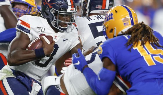 Virginia quarterback Bryce Perkins (3), left, runs as Pittsburgh defensive back Jason Pinnock (15) pursues in the first quarter of an NCAA college football game, Saturday, Aug. 31, 2019, in Pittsburgh. (AP Photo/Keith Srakocic)