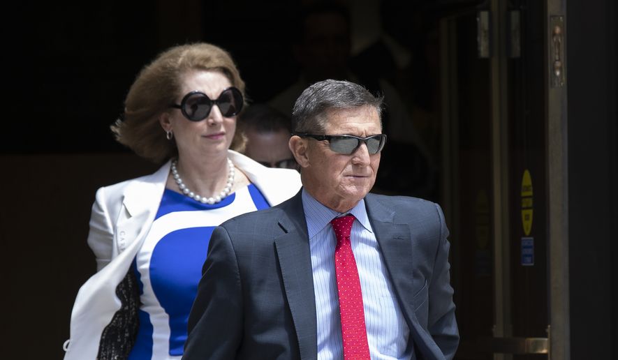Former National Security Adviser Michael Flynn leaves the federal courthouse in Washington on Monday, June 24, 2019. Flynn&#39;s lawyer Sidney Powell is at left. (AP Photo/Manuel Balce Ceneta) ** FILE **