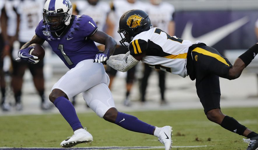 TCU&#x27;s Jalen Reagor (1) is tackled by Aransas-Pine Bluff&#x27;s Taeyler Porter during the first half of an NCAA college football game Saturday, Aug. 31, 2019, in Fort Worth, Texas. (David Kent/Star-Telegram via AP)