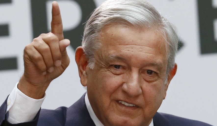 Mexican President Andrés Manuel López Obrador gives his first year&#x27;s state of the nation address at the National Palace in Mexico City, Sunday, Sept. 1, 2019. (AP Photo/Marco Ugarte)