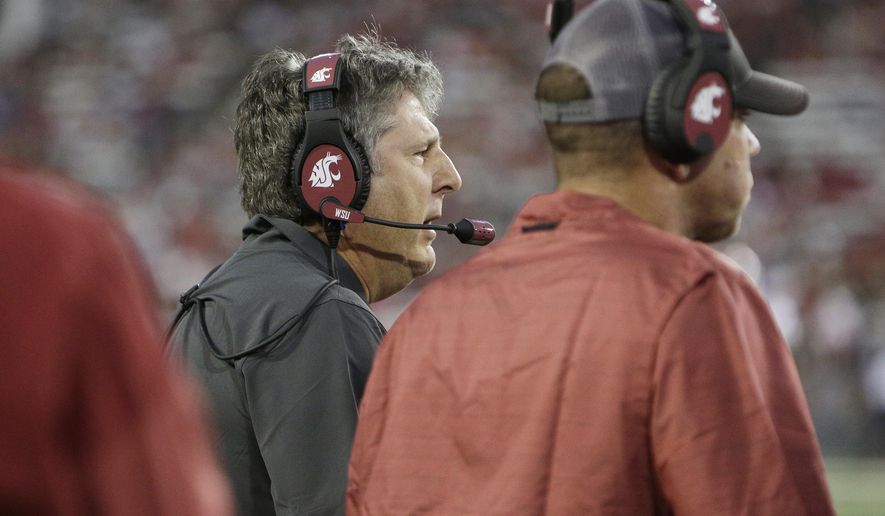 Washington State coach Mike Leach speaks to his team during the first half of an NCAA college football game against New Mexico State in Pullman, Wash., Saturday, Aug. 31, 2019. (AP Photo/Young Kwak)