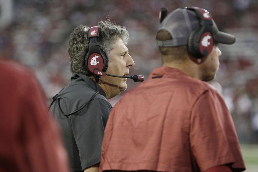 Washington State coach Mike Leach speaks to his team during the first half of an NCAA college football game against New Mexico State in Pullman, Wash., Saturday, Aug. 31, 2019. (AP Photo/Young Kwak)
