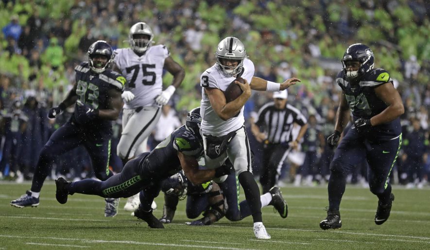 Oakland Raiders quarterback Nathan Peterman (3) scrambles, but Seattle Seahawks linebacker Cody Barton (57) makes the tackle during the first half of an NFL football preseason game Thursday, Aug. 29, 2019, in Seattle. (AP Photo/Stephen Brashear)