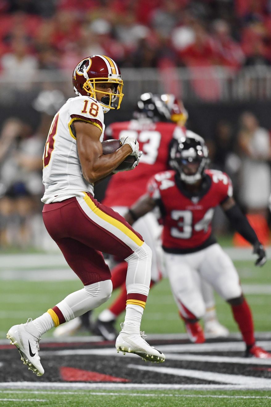 Washington Redskins wide receiver Josh Doctson (18) makes the catch against Atlanta Falcons defensive back Chris Cooper (34) during the first half an NFL preseason football game, Thursday, Aug. 22, 2019, in Atlanta. (AP Photo/Mike Stewart)